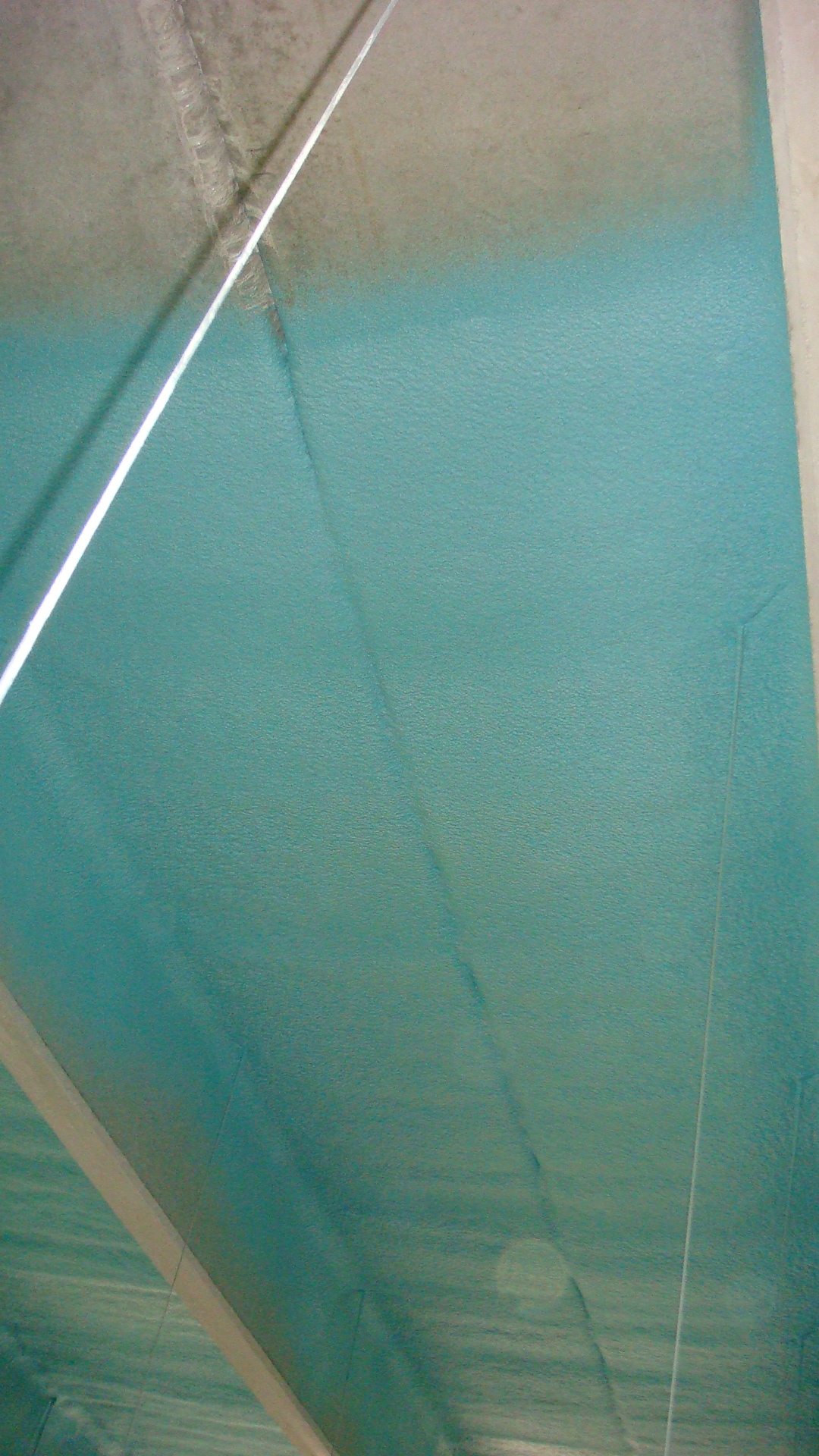 Elevated metal walkway and catwalk protected with a polyurea coating