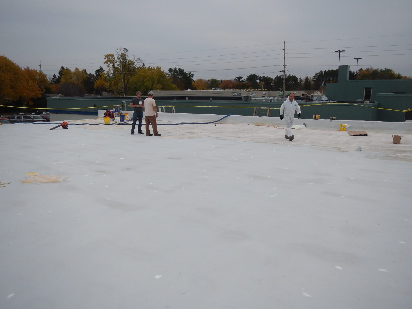 Metal roof deck coated with polyurea membrane